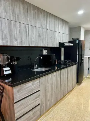 a kitchen with a sink and a refrigerator at Apartamento en Manga in Cartagena de Indias