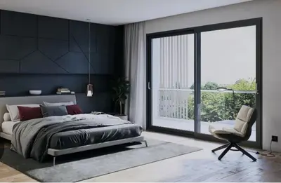 a bedroom with a bed and a chair and a window at Hotel El Confort in San Juan Nepomuceno