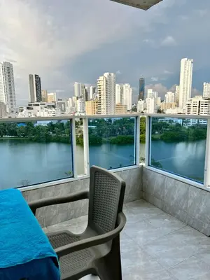 a balcony with a view of a river and a city at Apartamentos Por dias Laguito Ctg in Cartagena de Indias