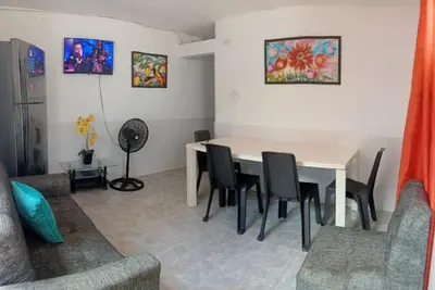 a dining room with a table and chairs at Le Petit Apartamento Con Encanto En Cartagena in Cartagena de Indias