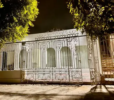 a metal gate in front of a building at Hostal Asturias Real in Barranquilla