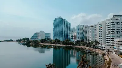 a city with tall buildings next to a body of water at Tranquila y cerca de la magia in Cartagena de Indias