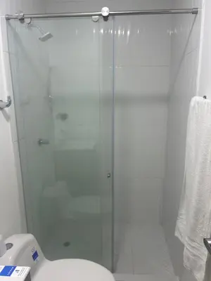 a glass shower in a bathroom with a toilet at Aparta suite in Cartagena de Indias