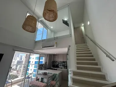 a staircase in a room with a stair case at APARTAMENTO MAGNO LOFT Bocagrande in Cartagena de Indias