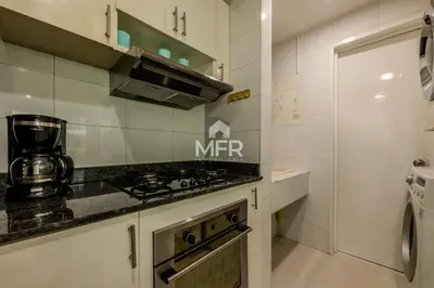 a kitchen with a stove and a counter top at Luxury beachfront Condo Edificio Morros 3 by Inmobiliaria MFR in Cartagena de Indias
