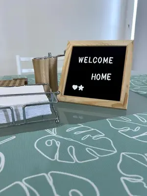 a sign that says welcome home on a table at Morros 922 Seaside Retreat in Cartagena de Indias