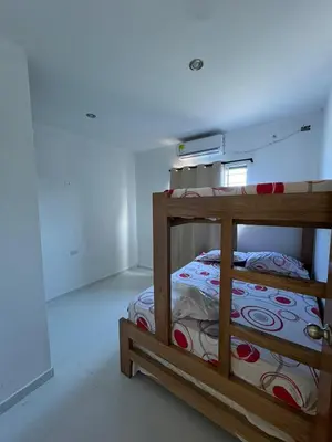 a bedroom with a bunk bed in a room at Apartamentos Altos de Guayabal in El Triunfo