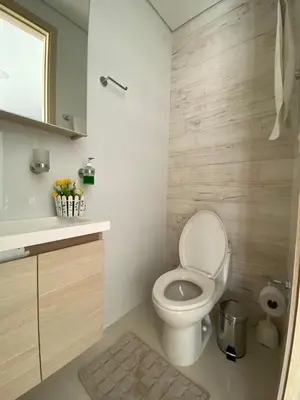 a bathroom with a white toilet and a sink at 1 bedroom apartment close to the beach in Cartagena de Indias