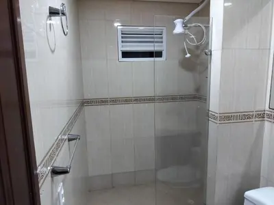 a bathroom with a shower with a glass door at Laguito Apartment in Cartagena de Indias