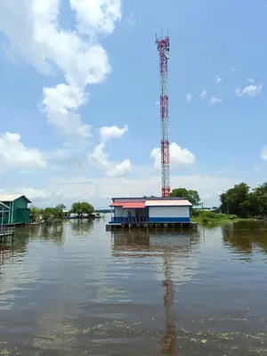a house in the middle of a flooded river at Laguna tour in Nueva Venecia