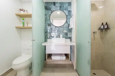 a bathroom with a sink and a mirror at CB910 | Suite frente al mar diseño moderno balcon in Cartagena de Indias