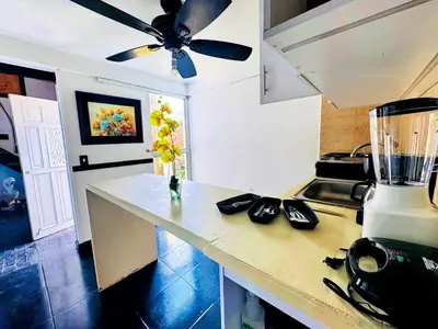 a kitchen with a counter with a blender on it at Auaecoco Hotel in Cartagena de Indias