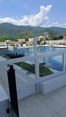 a balcony with a view of a swimming pool at Aparta suite cerca al mar por vía Irotama in Santa Marta