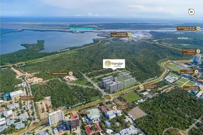 arial view of a city with buildings and a lake at Apartamento con vista única cerca de la Uninorte in Puerto Colombia