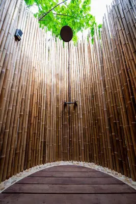 a bamboo fence with a wooden walkway at Isla Corona in Baru