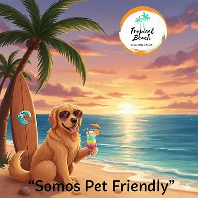a dog sitting on the beach with a cocktail at Tropical Beach in Playa Blanca