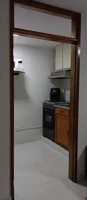 a kitchen with a stove and a counter top at Apartamento al norte de Barranquilla in Barranquilla