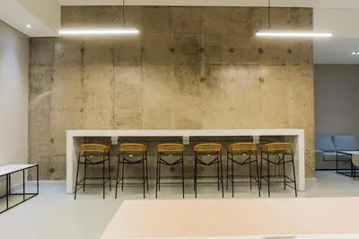 a bar with a row of stools in a room at Apto de Lujo con Vista al Mar en Playa Bello Horizonte in Santa Marta