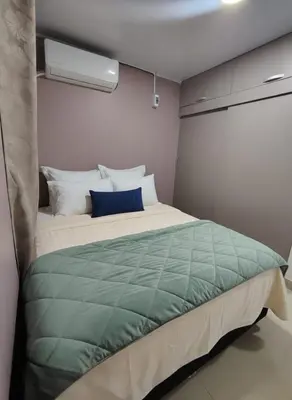 a bedroom with a large bed in a room at Casa Plenitud Lux in Cartagena de Indias