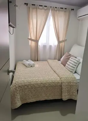 a bedroom with a bed with two towels on it at Casa Plenitud Lux in Cartagena de Indias