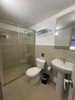 a bathroom with a toilet and a shower and a sink at HS-T Habitacion Triple con wifi, piscina y aire acondicionado in Cartagena de Indias