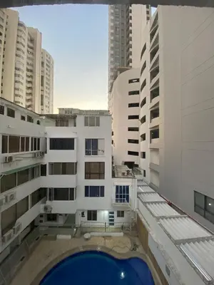 a view from the balcony of a building with a pool at Apartamento en Bocagrande muy cerca al mar! Apto 401 in Cartagena de Indias