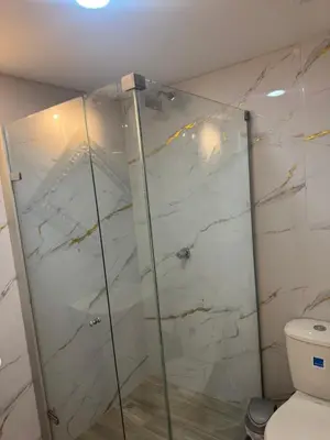 a bathroom with a shower and a toilet at Apartaestudio altos de riomar in Barranquilla