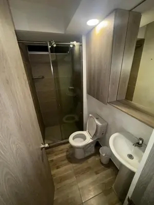 a bathroom with a shower and a toilet and a sink at New & peaceful apartment in Barranquilla