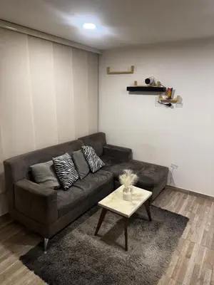 a living room with a couch and a coffee table at New & peaceful apartment in Barranquilla