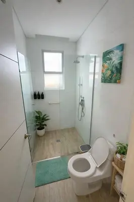 a bathroom with a toilet and a shower at Marina Puerto Velero, Villa frente al Mar in El Morro