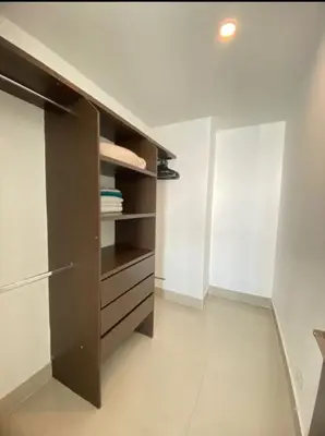 a kitchen with a brown cabinet in a room at 1PE-AL Apartamento de 1 alcoba frente al mar con Aire acondicionado, Piscina y Wifi in Cartagena de Indias