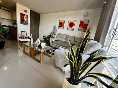 a living room with a couch and a table at Modern and cozy apartment at north in Barranquilla