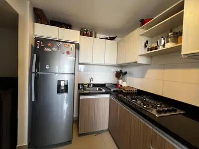 a kitchen with a stainless steel refrigerator and a stove at Modern and cozy apartment at north in Barranquilla