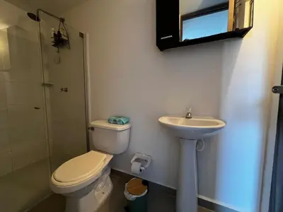 a bathroom with a toilet and a sink at Modern and cozy apartment at north in Barranquilla
