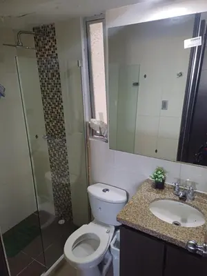 a bathroom with a toilet and a sink and a shower at Oporto in Barranquilla