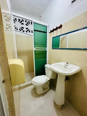 a bathroom with a toilet and a sink at Hostal La Española de Getsemani in Cartagena de Indias