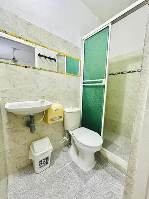 a bathroom with a toilet and a sink and a shower at Hostal La Española de Getsemani in Cartagena de Indias