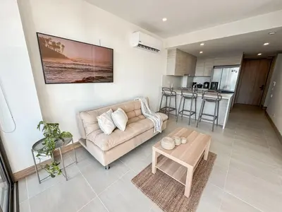 a living room with a couch and a table at Apartamento Morros C28 acceso directo al Mar Manzanillo in Cartagena de Indias