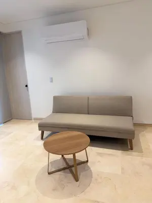 a couch and a table in a living room at Del Mar City View in Cartagena de Indias