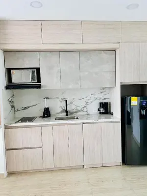 a kitchen with a sink and a microwave at Hermosa APARTASUITE EN CARTAGENA!! in Cartagena de Indias