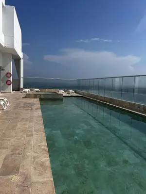 a swimming pool on the side of a building at HERMOSO APARTAMENTO VISTA AL MAR PALMETTO SUNSET-El Laguito in Cartagena de Indias
