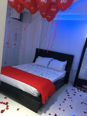 a bedroom with a bed with red hearts on the floor at Valmar apartamentos in Cartagena de Indias