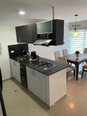 a kitchen with a counter top and a stove top oven at Modern Duplex en Riomar BQuilla in Barranquilla