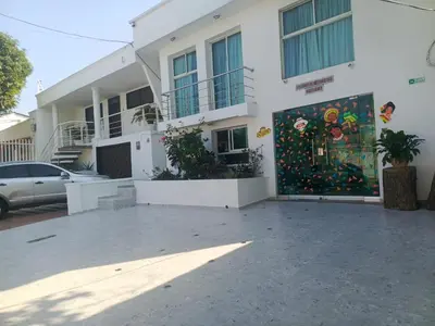 a building with a mural on the side of it at Golden House Studio Deluxe in Barranquilla