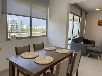 a dining room with a table and some chairs at Moderno Apartamento en Cartagena in Cartagena de Indias