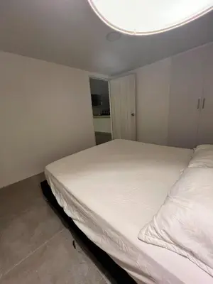 a bedroom with a white bed with a round ceiling at Apartamento en ciudad amurallada centro histórico Cartagena de Indias, Colombia in Cartagena de Indias