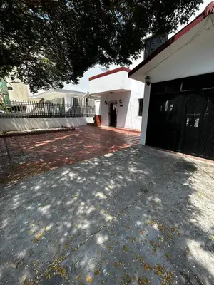 a driveway in front of a white building at Casa Naty Crespo in Cartagena de Indias