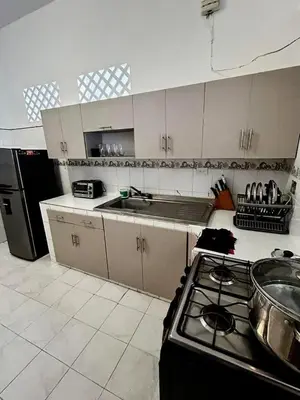 a kitchen with a stove and a counter top at Casa Naty Crespo in Cartagena de Indias