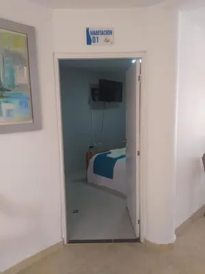 a room with a bedroom with a bed in it at Chalet Ledymar in Cartagena de Indias