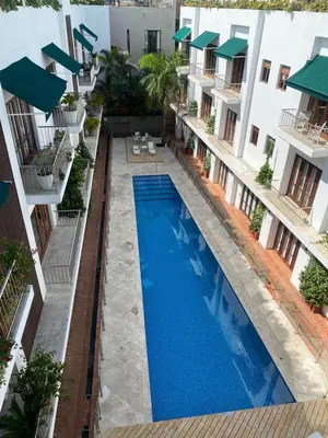 an aerial view of the courtyard of a building with a swimming pool at Luxury Apartment Private Pool & Rooftop Jacuzzi in Cartagena de Indias